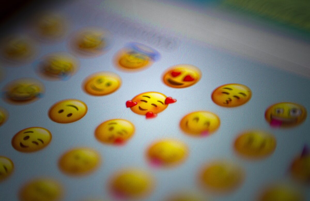 Emojis and Beyond: The Language of WhatsApp